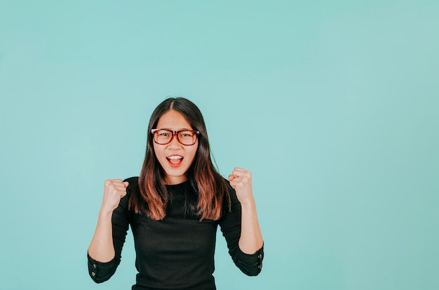 Asian woman celebrating success