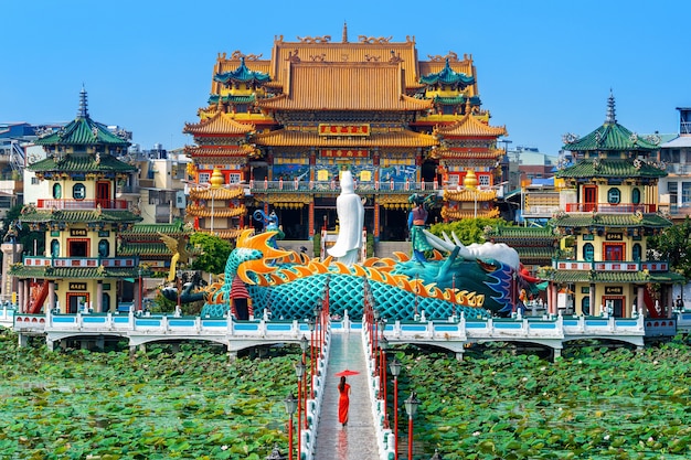 Asian woman in chinese dress traditional walking at temple in Kaohsiung, Taiwan.