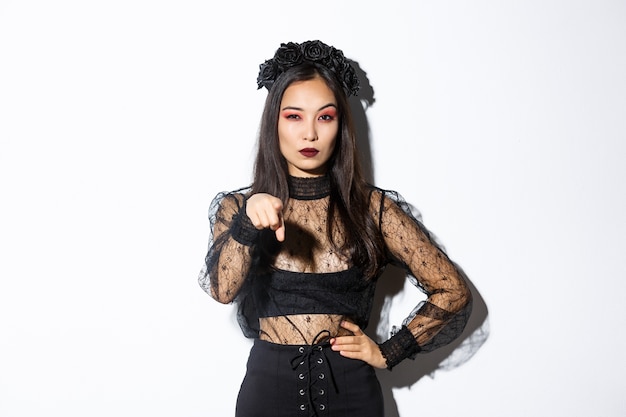 Asian woman in Halloween costume posing