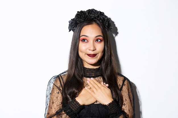 Asian woman in Halloween costume posing