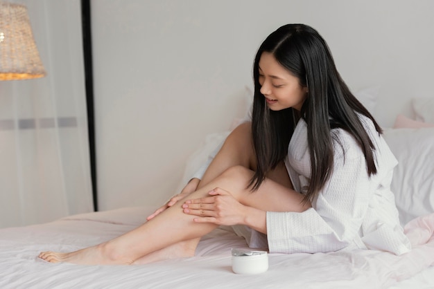 Free photo asian woman relaxing at home