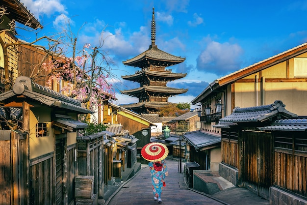 Asian woman wearing japanese traditional kimono at Yasaka Pagoda and Sannen Zaka Street in Kyoto, Japan.