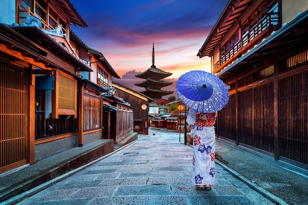 Asian woman wearing japanese traditional kimono at Yasaka Pagoda and Sannen Zaka Street in Kyoto, Japan.