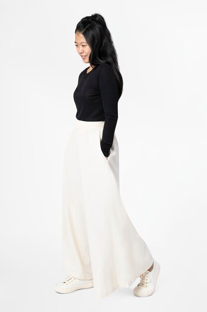 Asian woman in white palazzo pants with design space casual wear fashion full body