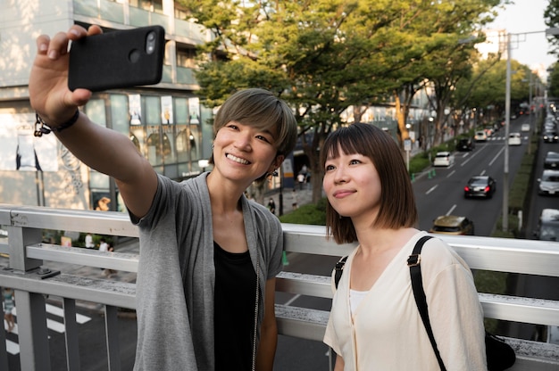 Free Photo asian women taking a selfie together