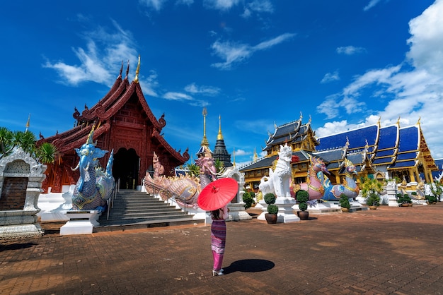 Free photo asian women wearing thai dress costume traditional according thai culture at temple in chiang mai