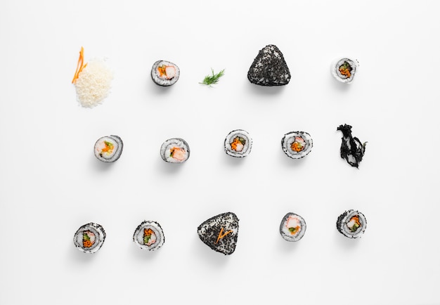 Asortment of maki sushi rolls n white background