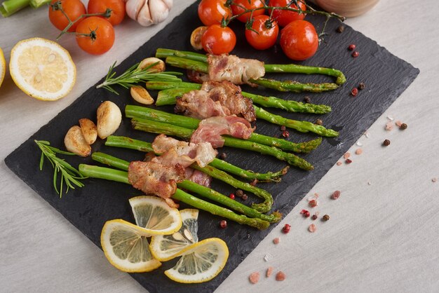 Asparagus baked with bacon and spices.