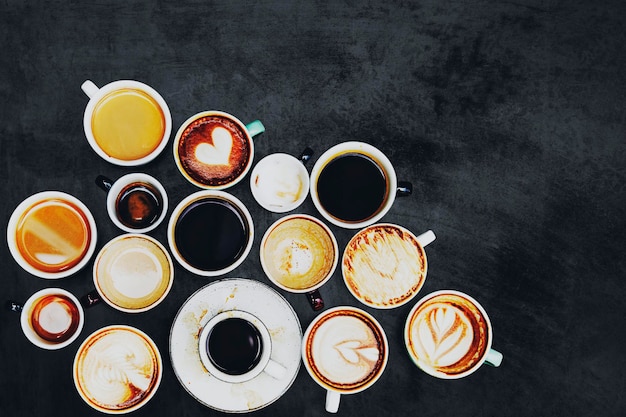 Free photo assorted coffee cups on a textured background