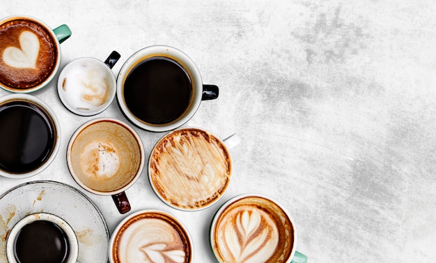 Free photo assorted coffee cups on a textured background