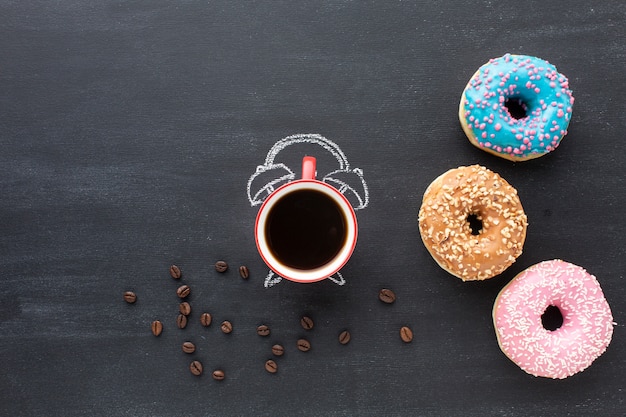 Assorted donuts and clock concept