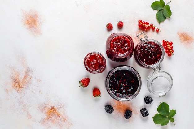 Free photo assortment of berry jams,top view