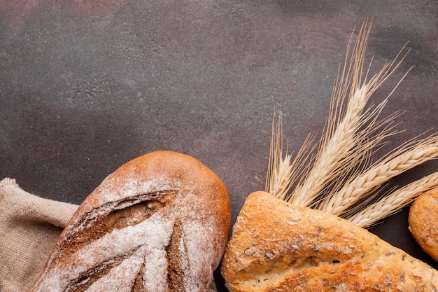 Free photo assortment of bread with wheat greass