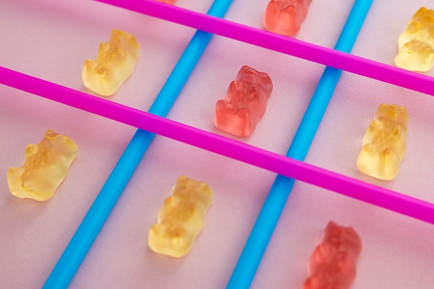 Free photo assortment of gummy bear candy with straws