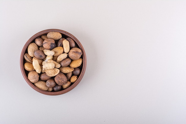 Assortment of shelled organic nuts placed on white background. High quality photo