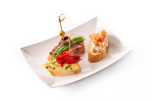 Assortment of Spanish pintxos isolated on white background