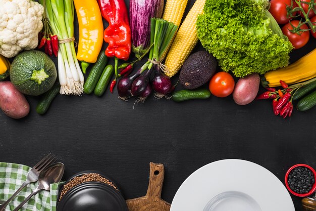 Assortment of vegetables and ceramic plate