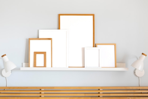 Free Photo assortment of white empty frames on table