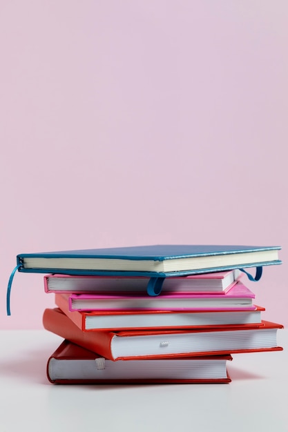 Assortment with books and pink background