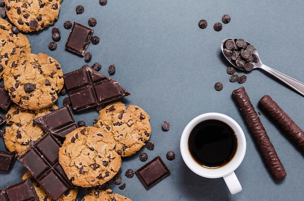 Assortment with cookies, chocolate sticks and coffee