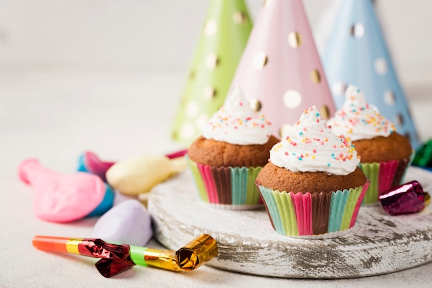 Free photo assortment with glazed muffins and party decorations