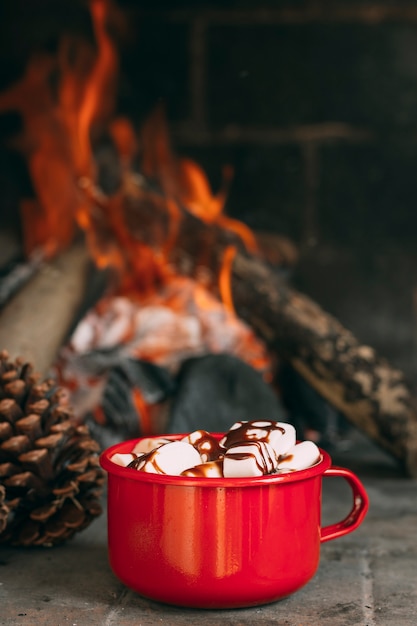 Free Photo assortment with mug near the fireplace