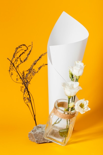 Free Photo assortment with white roses in a vase with a paper cone