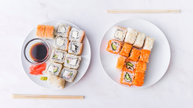 Assortments of sushi with sticks top view