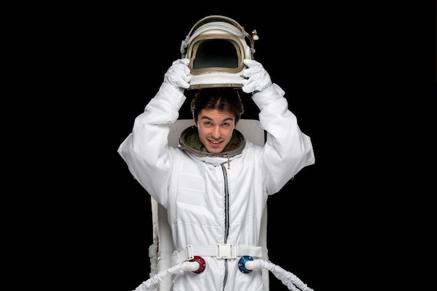 Free photo astronaut day happy spaceman in outer space cosmos galaxy taking helmet off smiling happy