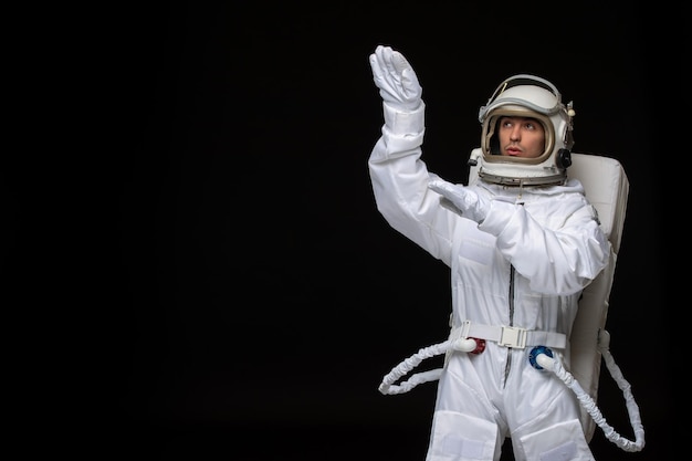 Astronaut day spaceman in cosmos space suit landed on moon hands up