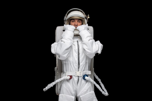 Free photo astronaut day spaceman moon outer space spacesuit helmet whistling calling for help