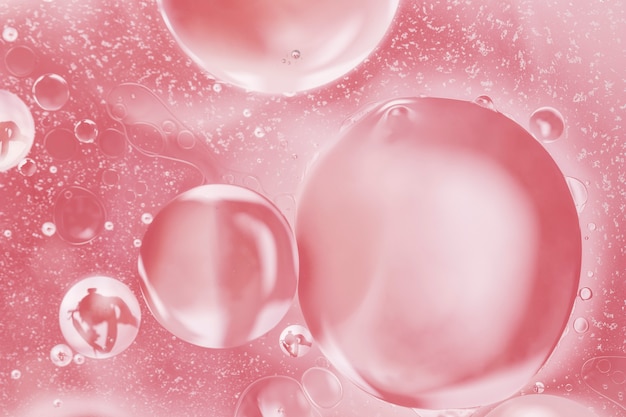 Asymetrical pink bubbles in abstract oil