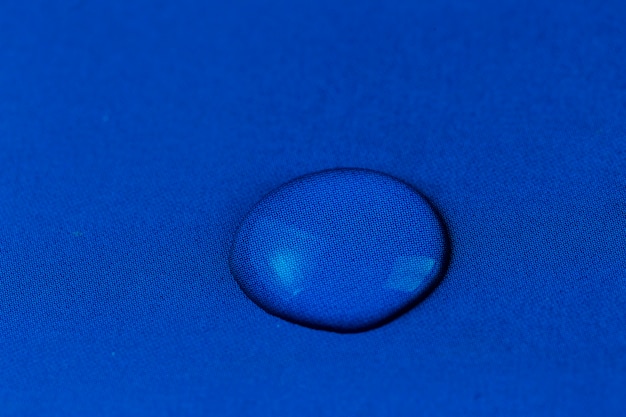 ater drop on blue cloth