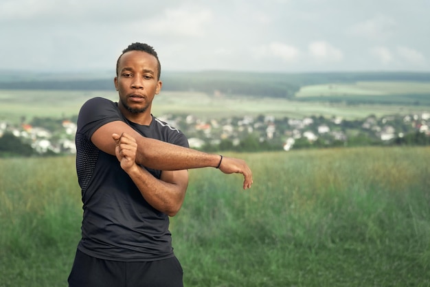 Athlete doing exercises for hands on nature