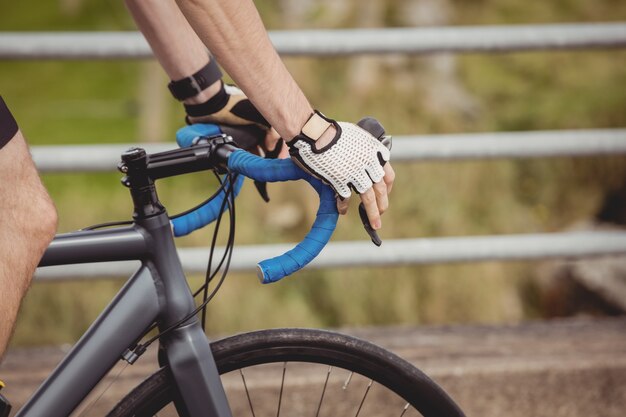 Athlete riding a bicycle on the road