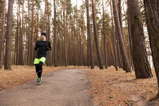 Athlete running in woods