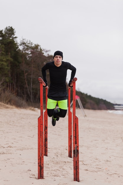 Free photo athlete working out on beach