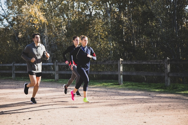 Free photo athletes running outdoors