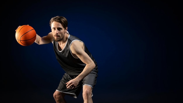 Athletic man holding a basketball