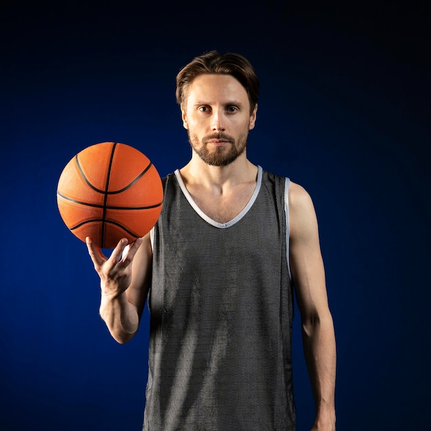 Athletic man holding a basketball