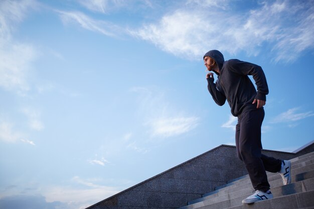 Athletic man jogging outdoors