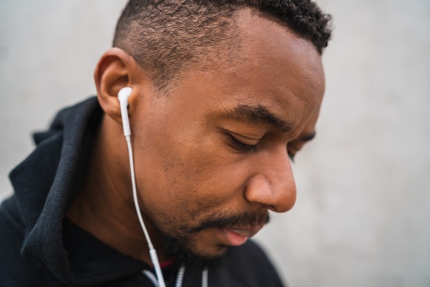 Athletic man listening to music.