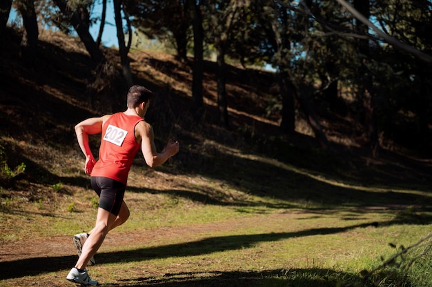 Athletic man participating in a cross country