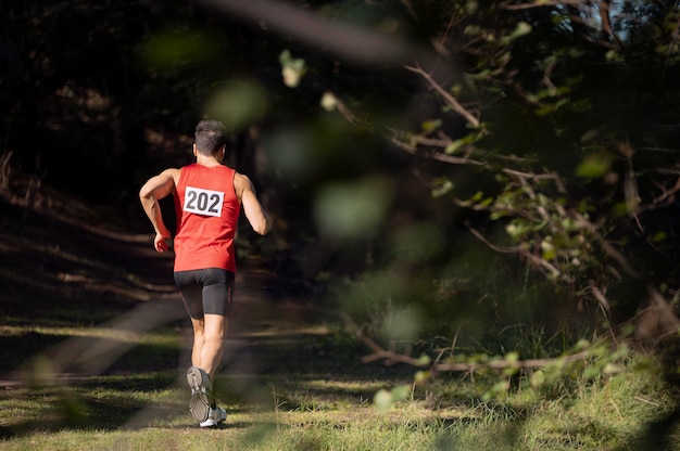 Athletic man participating in a cross country