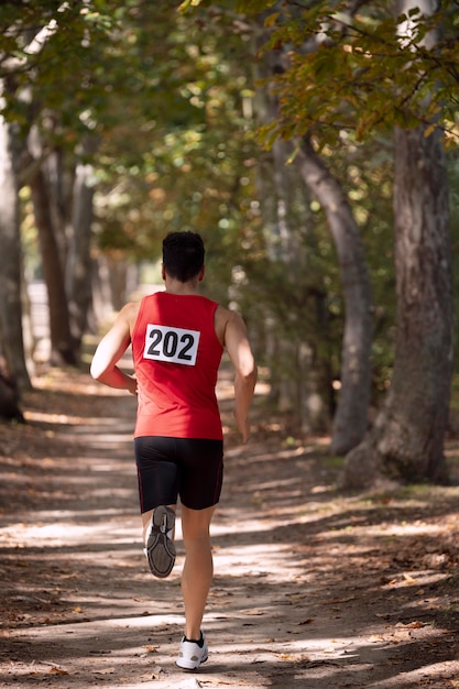 Athletic man participating in a cross country