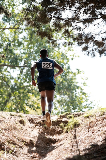 Athletic man participating in a cross country