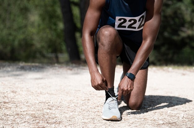 Athletic man participating in a cross country