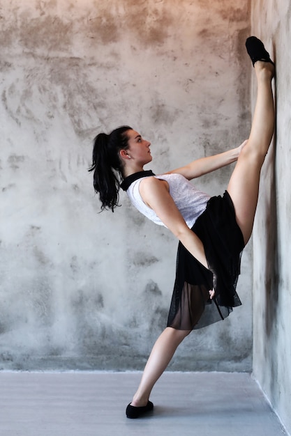 Free photo athletic woman doing gymnastic stretching