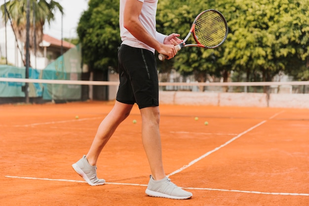 Athletic young boy playing tennis