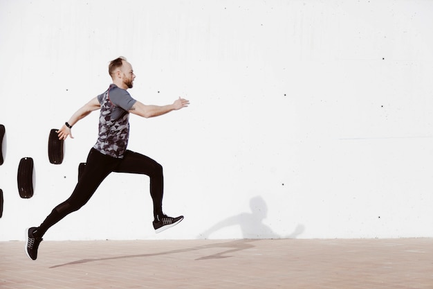 Free photo athletic young man running